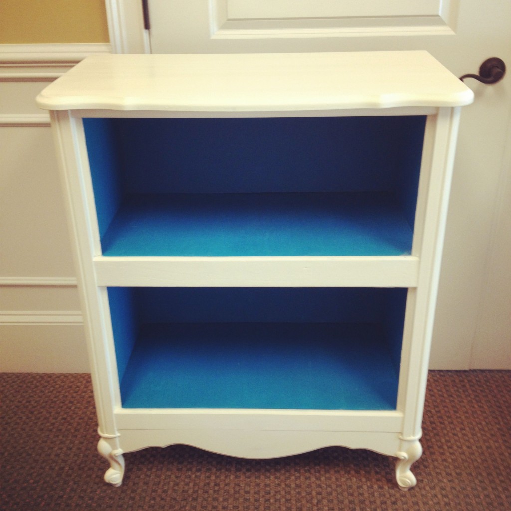 Blue inside white outside bookshelf