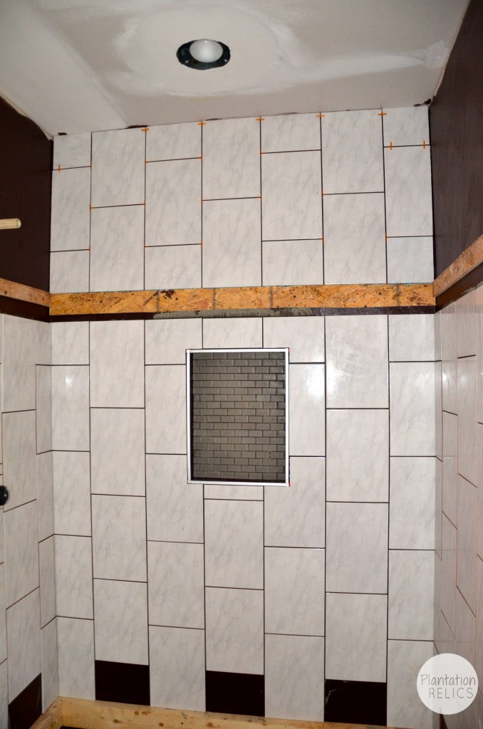 Hall bath tile start of shower flip
